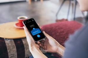 A person holding a phone

Description automatically generated with medium confidence